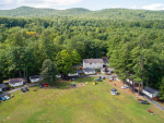 aerial view of large lawn and cabins