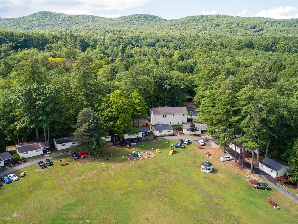 aerial view of large lawn and cabins