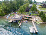 drone view of the lake shore with dock and deck