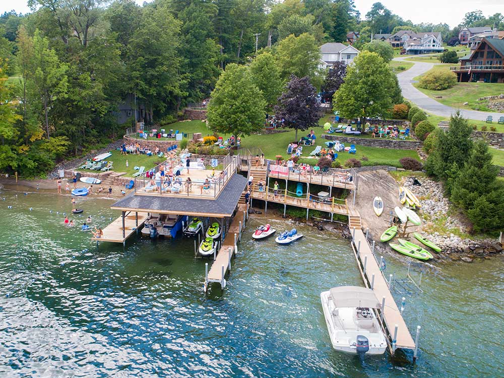 drone view of the lake shore with dock and deck