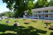picnic tables out on lawn in front of motel